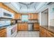 Kitchen features stainless steel appliances, granite countertops and light wood cabinets at 4550 Cove Cir # 502, St Petersburg, FL 33708