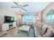 Spacious living room shows water view, ceiling fan and comfortable seating at 4550 Cove Cir # 502, St Petersburg, FL 33708