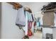 Efficient walk-in closet providing ample storage, with rods, shelves, and mirror, organizing clothes and accessories neatly at 4550 Cove Cir # 502, St Petersburg, FL 33708