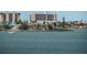 Wide water view showcases boat docks and buildings in the distance on a sunny day at 4550 Cove Cir # 502, St Petersburg, FL 33708