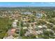 Wide aerial view of a community with mature trees, serene lakes, and well-spaced homes at 5269 White Sand Ne Cir, St Petersburg, FL 33703