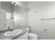 Bathroom with a large mirror, toilet, and vanity with sink, featuring neutral walls and lighting at 5269 White Sand Ne Cir, St Petersburg, FL 33703