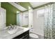 Bathroom features a marble vanity, a large mirror, and a shower-tub combination at 5269 White Sand Ne Cir, St Petersburg, FL 33703