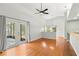 Open dining room with hardwood floors, backyard access, and views into the kitchen at 5269 White Sand Ne Cir, St Petersburg, FL 33703
