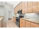 Spacious kitchen with stainless steel oven, granite counters and wood cabinets at 5269 White Sand Ne Cir, St Petersburg, FL 33703