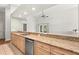 Kitchen with stainless steel appliances, wood cabinets, and granite countertops at 5269 White Sand Ne Cir, St Petersburg, FL 33703