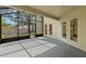 Large screened lanai with views of the backyard and multiple access doors at 5269 White Sand Ne Cir, St Petersburg, FL 33703