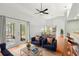 Cozy living room features plush seating, a bar area, and access to a screened-in porch at 5269 White Sand Ne Cir, St Petersburg, FL 33703