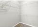 Walk-in closet with white wire shelving providing ample storage space at 5269 White Sand Ne Cir, St Petersburg, FL 33703