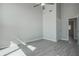 Bedroom features a ceiling fan, neutral gray walls and trim, with light gray flooring at 5768 75Th N Ter, Pinellas Park, FL 33781