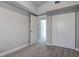Bedroom with closet and doorway, featuring neutral gray walls, trim and flooring at 5768 75Th N Ter, Pinellas Park, FL 33781