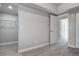 Bedroom with closet and doorway, featuring neutral gray walls, trim and flooring at 5768 75Th N Ter, Pinellas Park, FL 33781