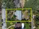 Aerial view of a house with a large lot outlined in yellow at 627 38Th Ne Ave, St Petersburg, FL 33704