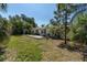 A spacious backyard with a patio and a small shed at 627 38Th Ne Ave, St Petersburg, FL 33704