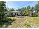 Spacious backyard features a wooden deck, perfect for outdoor entertaining and relaxation at 627 38Th Ne Ave, St Petersburg, FL 33704