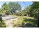 Lush backyard retreat featuring mature trees, a wooden deck, and plenty of privacy at 627 38Th Ne Ave, St Petersburg, FL 33704