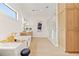 Well-lit bathroom featuring a soaking tub, large walk-in shower, and double vanity with wood cabinetry at 634 Poinsettia Rd, Belleair, FL 33756