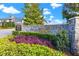 Attractive community entrance sign surrounded by manicured landscaping under a bright sky at 634 Poinsettia Rd, Belleair, FL 33756
