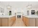 Gorgeous kitchen featuring double islands, pendant lighting, and modern appliances at 634 Poinsettia Rd, Belleair, FL 33756