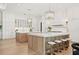 Bright kitchen with dual islands, barstool seating, and custom cabinetry for a modern and functional space at 634 Poinsettia Rd, Belleair, FL 33756