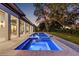 Scenic backyard featuring a pool, jacuzzi, and spacious patio at 634 Poinsettia Rd, Belleair, FL 33756