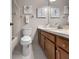 Well-lit bathroom with a vanity, a tub-shower, and neutral decor, perfect for relaxation at 7508 Hollowell Dr, Tampa, FL 33615