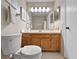 Functional bathroom with a vanity and a large mirror, designed for everyday convenience at 7508 Hollowell Dr, Tampa, FL 33615