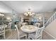 Cozy dining area with a round table and a view of the living room, ideal for Gathering meals at 7508 Hollowell Dr, Tampa, FL 33615