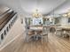 Open-concept dining room with a view to the kitchen, seamlessly connecting the living spaces at 7508 Hollowell Dr, Tampa, FL 33615