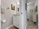Convenient half bathroom on the first floor, featuring a vanity with storage and neutral decor at 7508 Hollowell Dr, Tampa, FL 33615