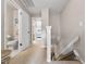 Second-floor hallway with convenient access to the bathroom and bedrooms, enhancing daily living at 7508 Hollowell Dr, Tampa, FL 33615