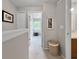 Upstairs hallway with carpet, leading to bedrooms and bathrooms, creating a comfortable flow at 7508 Hollowell Dr, Tampa, FL 33615