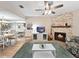 Spacious living area featuring a decorative fireplace open to the dining area at 7508 Hollowell Dr, Tampa, FL 33615