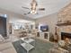 Inviting living room with fireplace open to dining area; great for entertaining and gatherings at 7508 Hollowell Dr, Tampa, FL 33615
