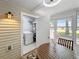 Cozy patio space with a washing machine, seating area, and natural light, perfect for relaxation and convenience at 7508 Hollowell Dr, Tampa, FL 33615