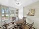 Charming patio with comfortable seating, ideal for relaxing and enjoying the outdoor view with natural light at 7508 Hollowell Dr, Tampa, FL 33615