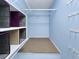 Spacious walk-in closet with adjustable shelving and ample storage space, perfect for organizing clothes and accessories at 7508 Hollowell Dr, Tampa, FL 33615