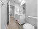 This bathroom boasts modern fixtures and upgrades, including an open doorway and a vanity area at 804 Pineland Ave, Venice, FL 34285