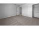 Spacious bedroom with neutral carpet and ample closet space at 804 Pineland Ave, Venice, FL 34285