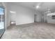 Open-concept living space with tile flooring and natural light with views into kitchen at 804 Pineland Ave, Venice, FL 34285