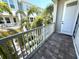 Relaxing tiled balcony with white railings and palm tree views providing a serene outdoor retreat at 813 Burlington N Ave, St Petersburg, FL 33701