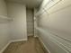 Spacious walk-in closet with carpeted floor and wire shelving units at 813 Burlington N Ave, St Petersburg, FL 33701