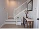 Inviting home foyer featuring a staircase with white railings, light-wood floor and a stylish console table at 813 Burlington N Ave, St Petersburg, FL 33701
