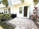 Charming courtyard with decorative pavers, plants, and a blue door at 813 Burlington N Ave, St Petersburg, FL 33701