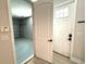 View of the property's garage and entrance from a bright, modern entryway with tiled flooring at 813 Burlington N Ave, St Petersburg, FL 33701