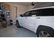 Neat garage interior with a white SUV parked inside, offering secure and convenient vehicle storage at 813 Burlington N Ave, St Petersburg, FL 33701
