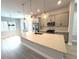 Bright, modern kitchen boasts an island, stainless appliances, and stylish pendant lighting fixtures at 813 Burlington N Ave, St Petersburg, FL 33701