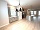 Bright, modern kitchen with sleek gray cabinets, stainless steel appliances, and stylish pendant lights at 813 Burlington N Ave, St Petersburg, FL 33701