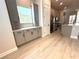 Modern kitchen with stylish gray cabinetry, stainless appliances, and wood-style flooring for a contemporary feel at 813 Burlington N Ave, St Petersburg, FL 33701