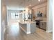 Modern kitchen featuring a center island, stainless steel appliances, and stylish gray cabinetry at 813 Burlington N Ave, St Petersburg, FL 33701